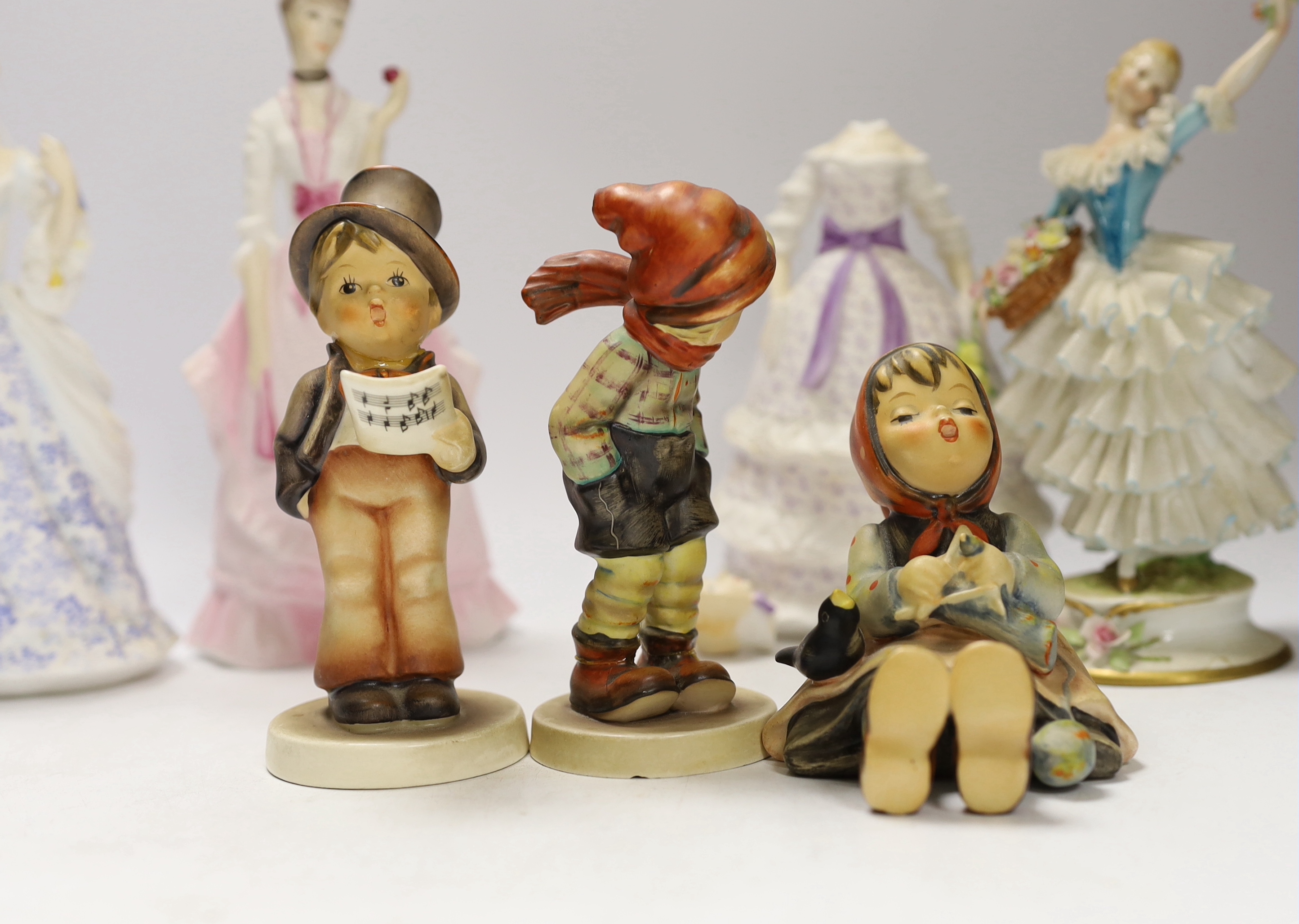 Two Doulton figures, three Worcester figures, Goebel figures and a continental figure